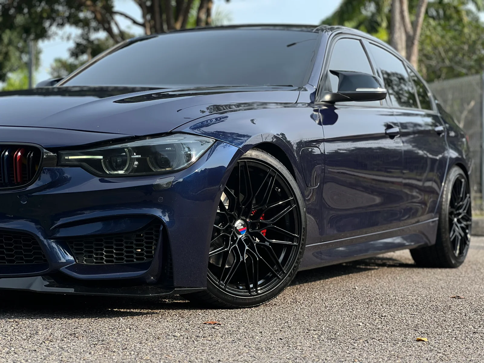 Dark blue BMW fitted with black performance wheels